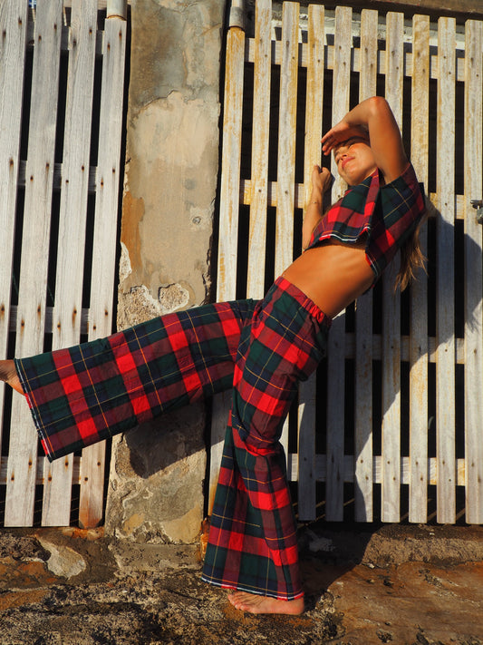 A stunning two-piece upcycled set featuring a vibrant red and blue checked design wide leg pants with elastic waste and crop top.