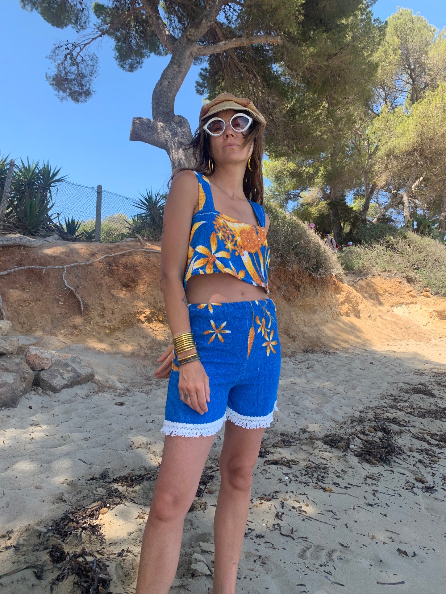 Up-cycled terry towelling shorts only by Vagabond Ibiza bright blue with orange floral detail