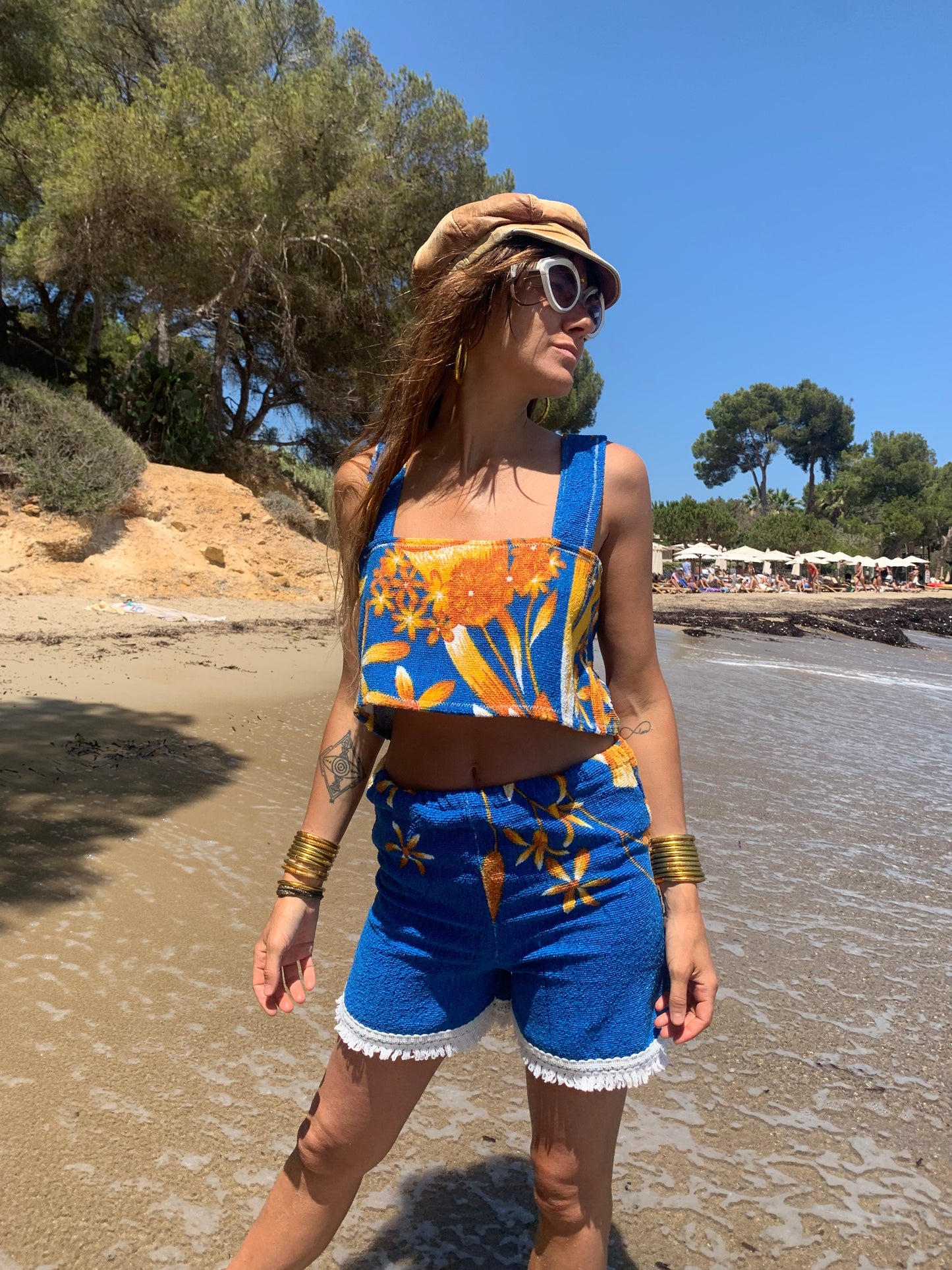 Up-cycled terry towelling shorts only by Vagabond Ibiza bright blue with orange floral detail