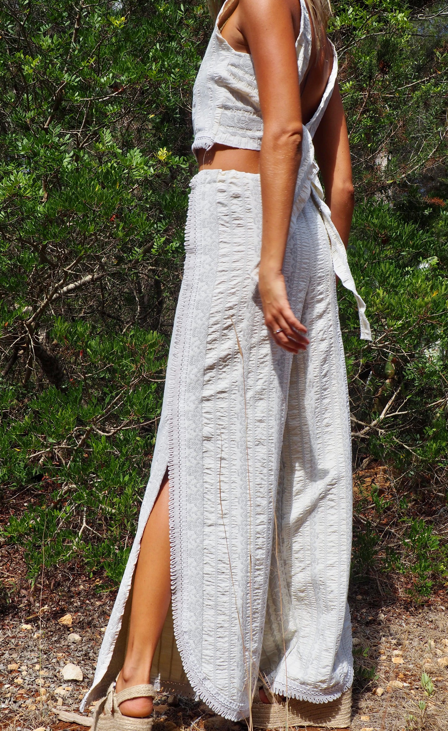 Up-cycled heavy cream and gray cotton woven textile wide leg pants with elastics and waist and side split details made by Vagabond Ibiza