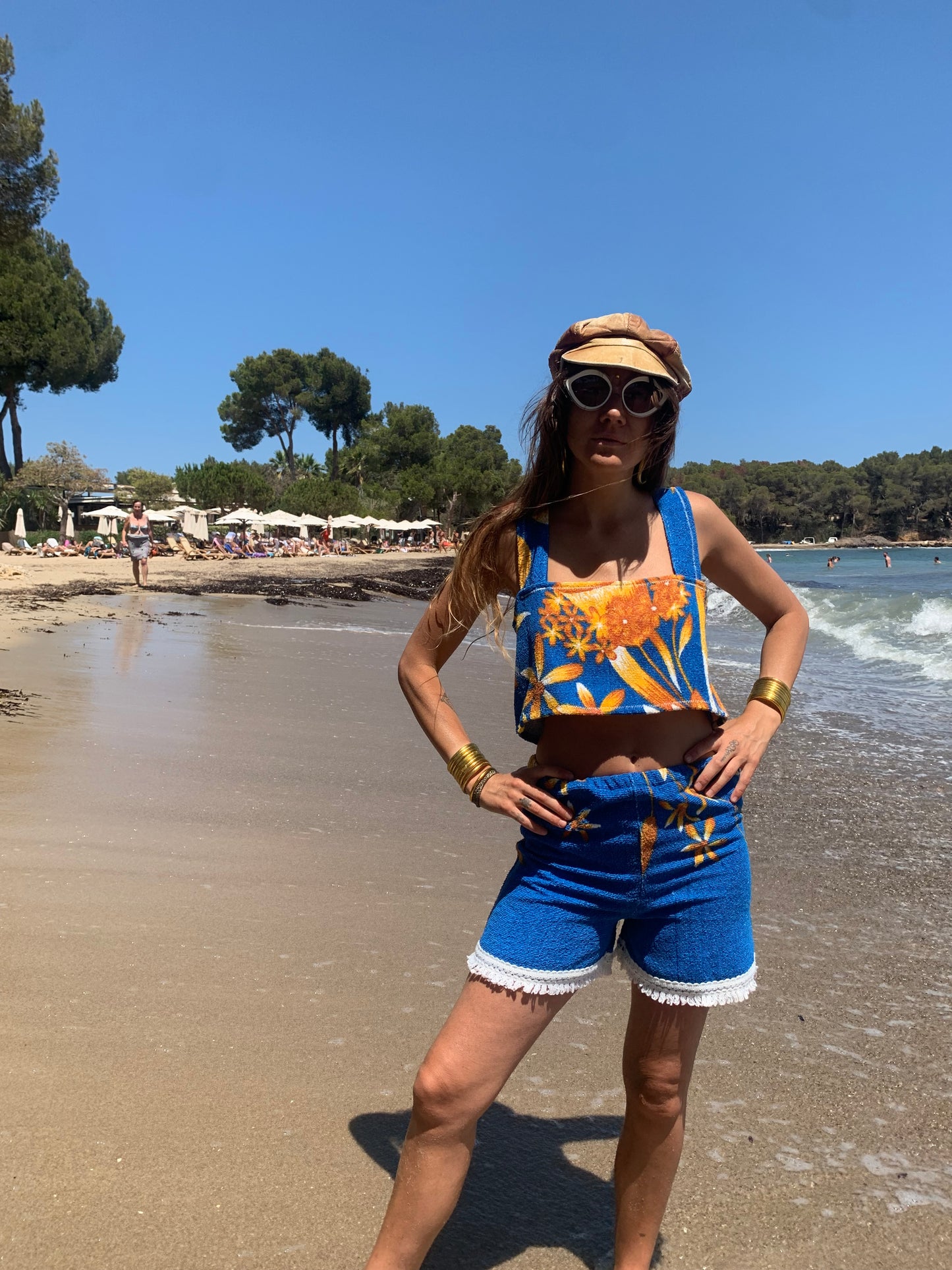 Up-cycled terry towelling shorts only by Vagabond Ibiza bright blue with orange floral detail