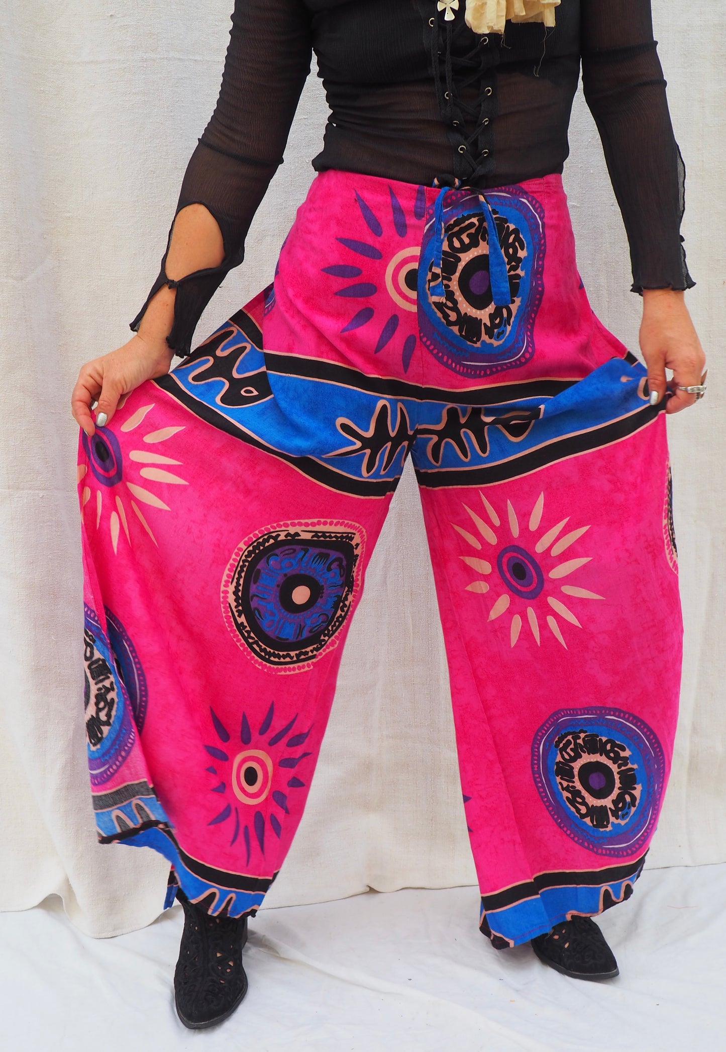 Wrap pants with side splits in pink and blue patterned design