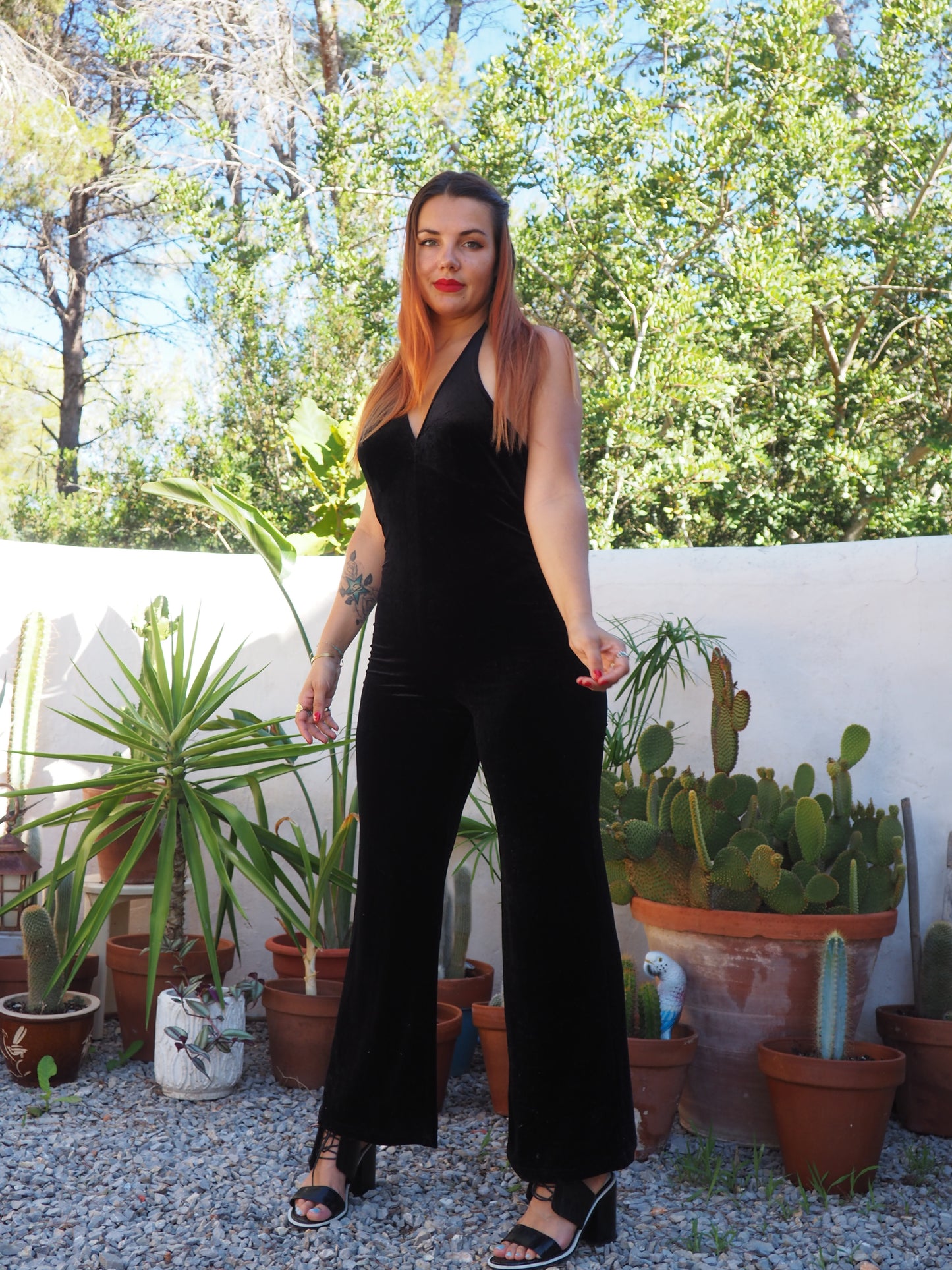 Vintage black thin velvet halter neck jumpsuit with bell bottom flare with stretch