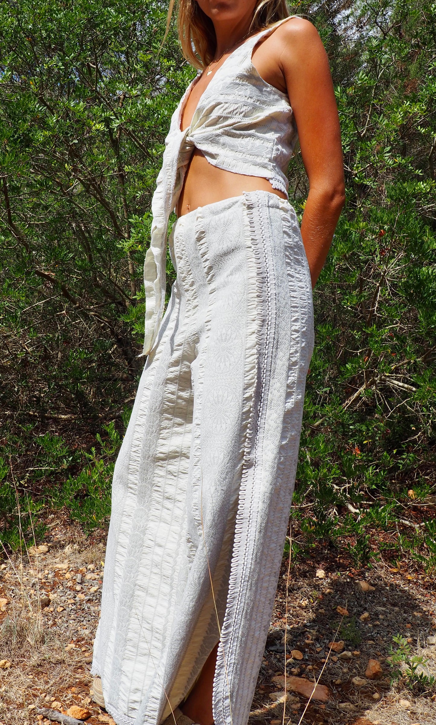 Up-cycled heavy cream and gray cotton woven textile wide leg pants with elastics and waist and side split details made by Vagabond Ibiza