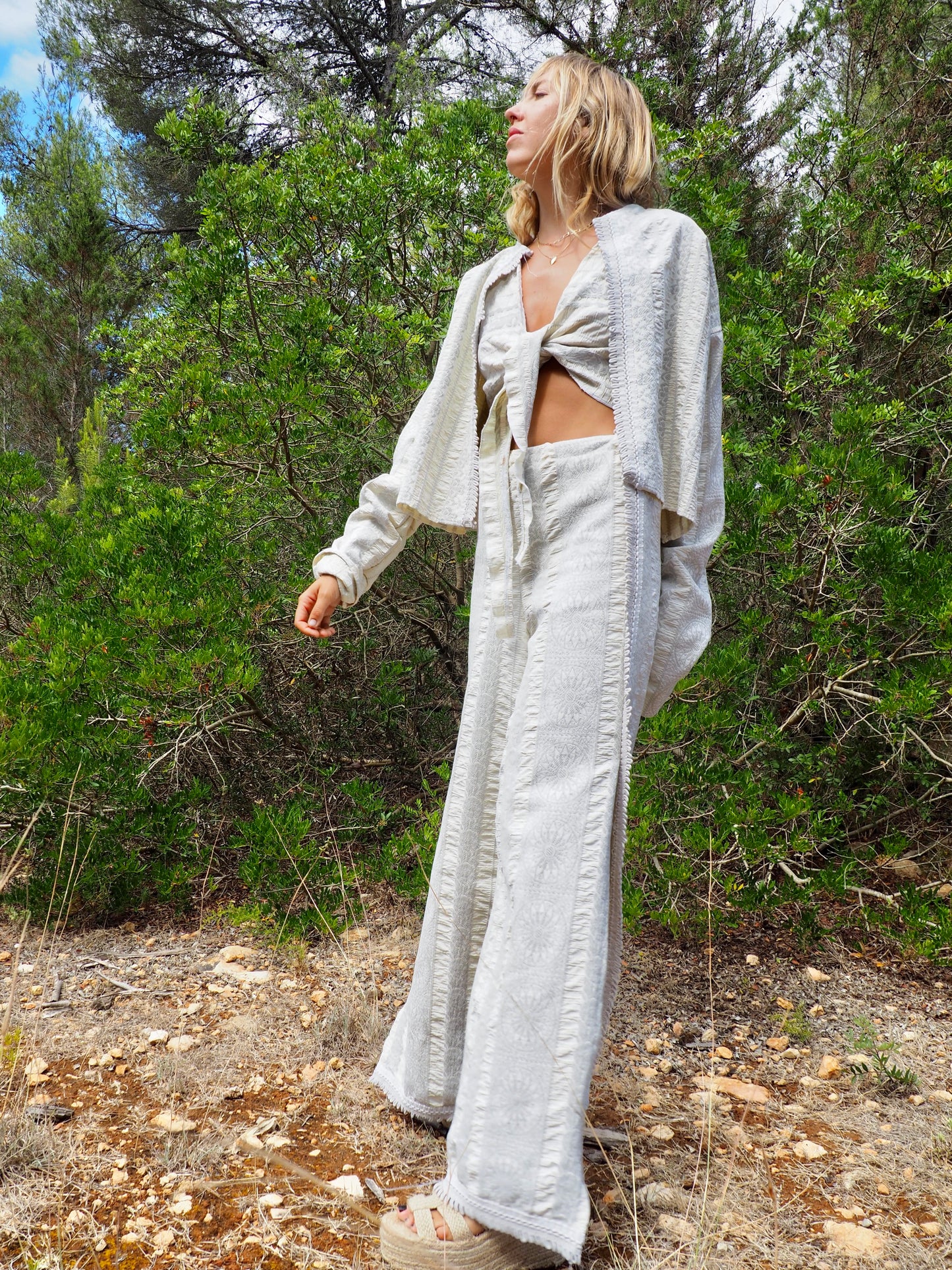 Up-cycled heavy cream and gray cotton woven textile wide leg pants with elastics and waist and side split details made by Vagabond Ibiza