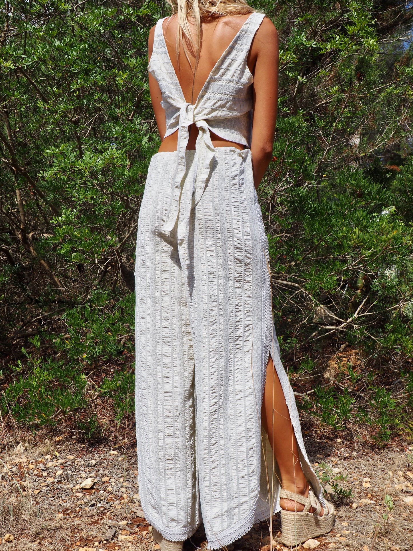 Up-cycled heavy cream and gray cotton woven textile wide leg pants with elastics and waist and side split details made by Vagabond Ibiza
