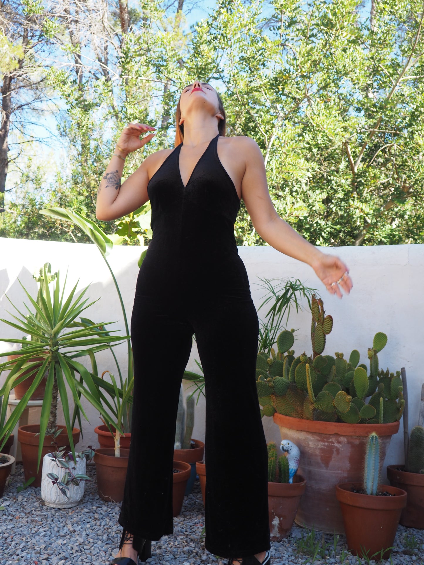Vintage black thin velvet halter neck jumpsuit with bell bottom flare with stretch