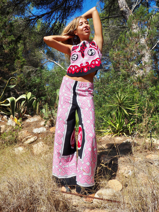 Up-cycled cotton wide leg pants pink and black with vibrant print design and circular motifs by Vagabond Ibiza