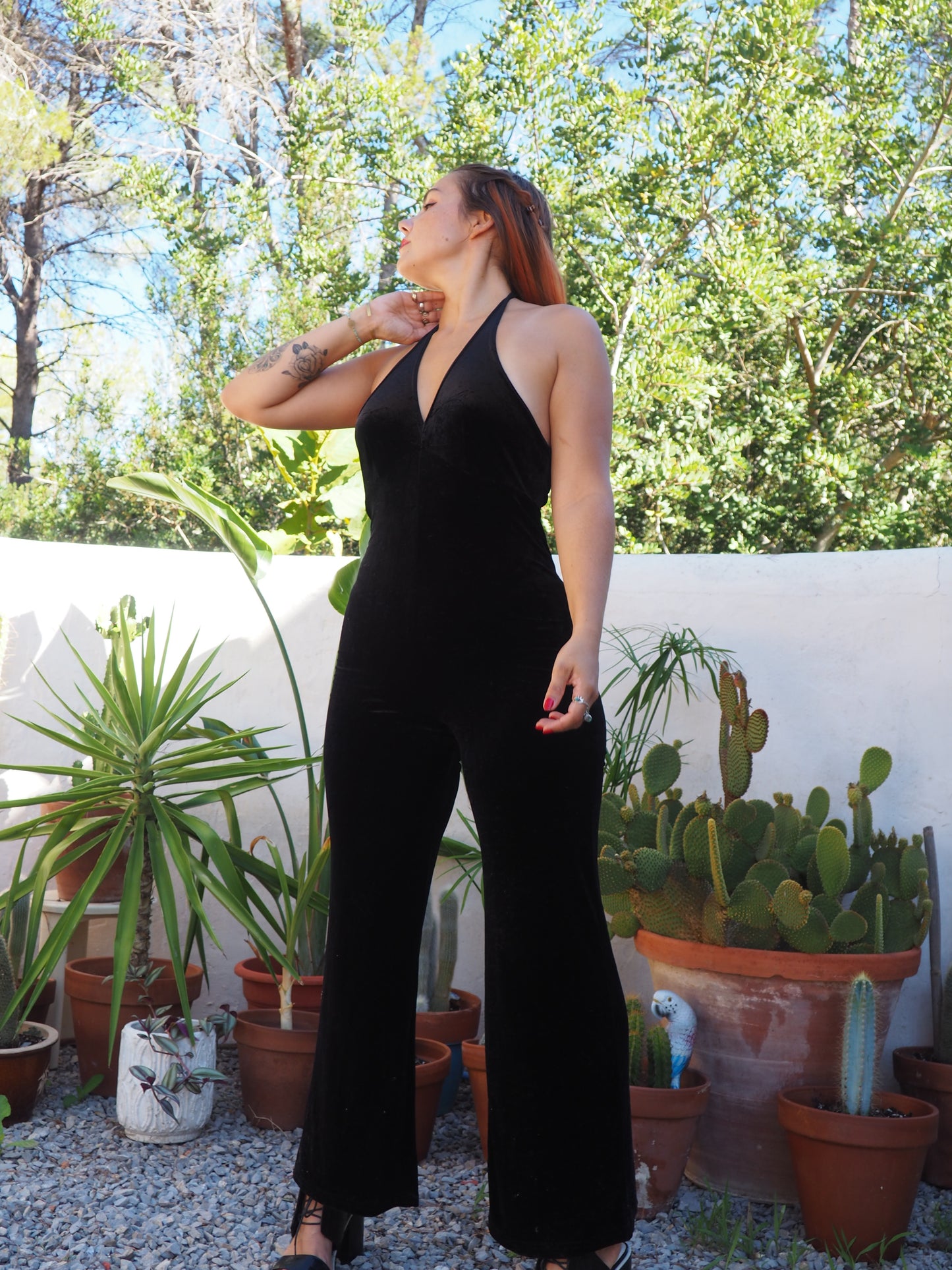 Vintage black thin velvet halter neck jumpsuit with bell bottom flare with stretch