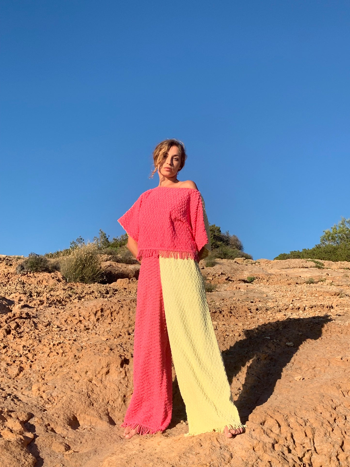 Handmade pastel patchwork towel set in pink and yellow, featuring long sleeve top and wide-leg trousers, upcycled in Ibiza.