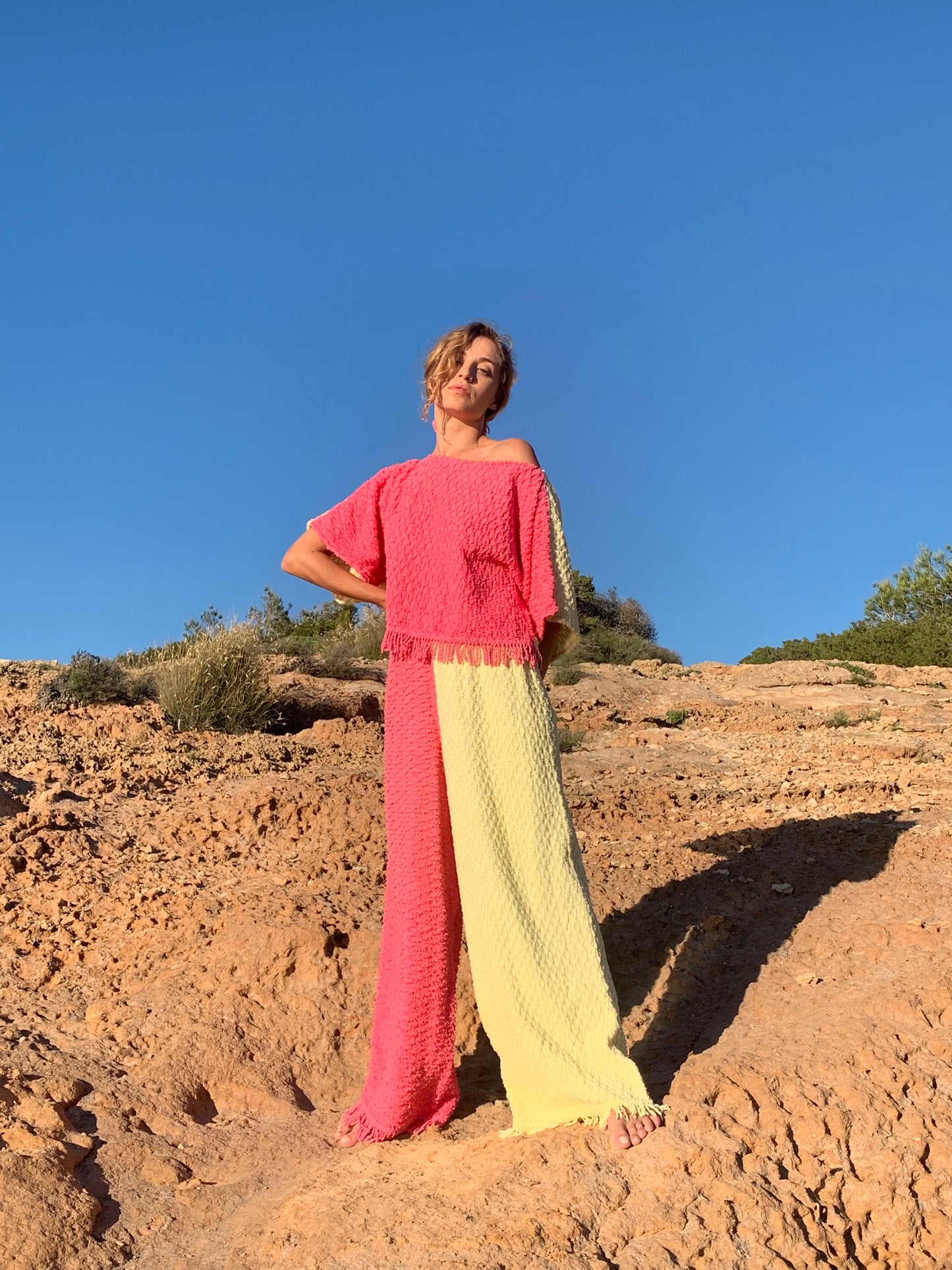 Handmade pastel patchwork towel set in pink and yellow, featuring long sleeve top and wide-leg trousers, upcycled in Ibiza.