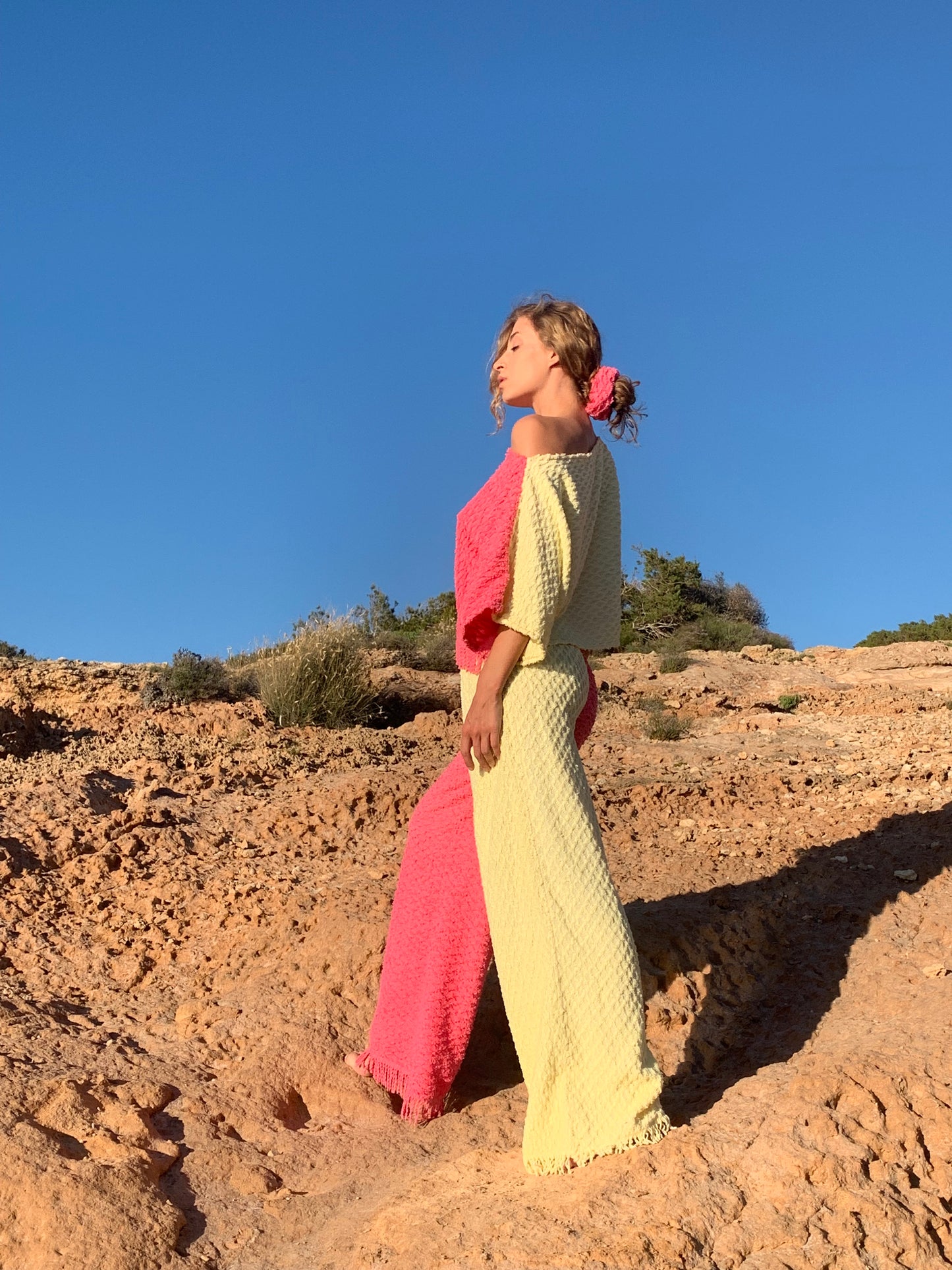 Handmade pastel patchwork towel set in pink and yellow, featuring long sleeve top and wide-leg trousers, upcycled in Ibiza.