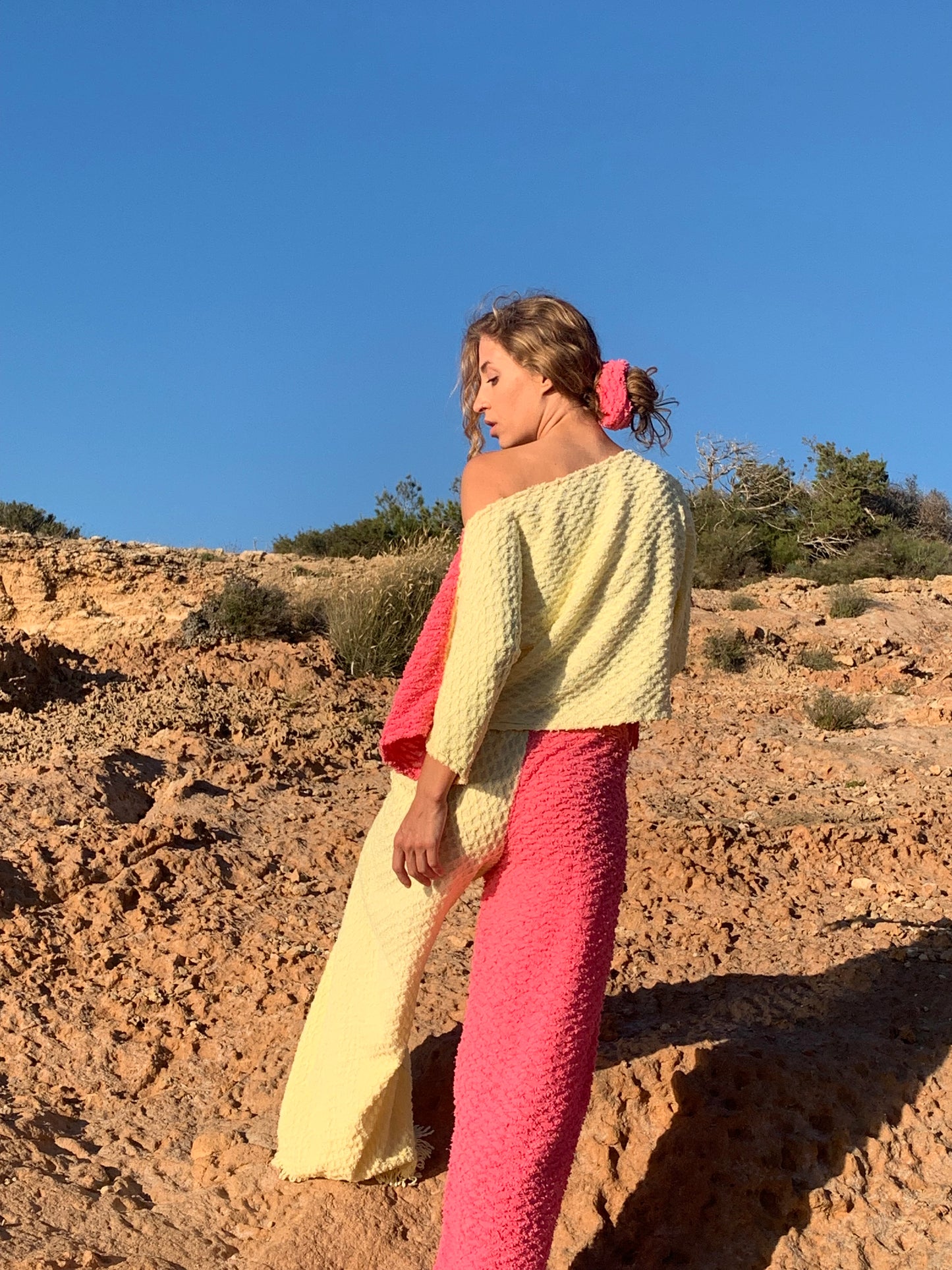 Handmade pastel patchwork towel set in pink and yellow, featuring long sleeve top and wide-leg trousers, upcycled in Ibiza.