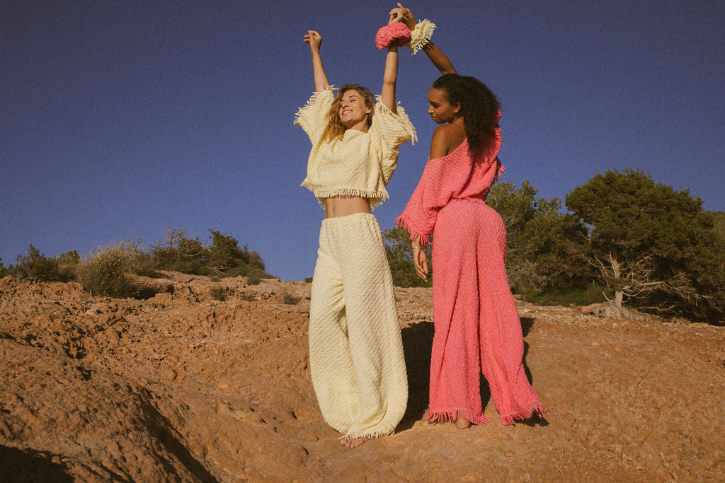 Upcycled bright yellow vintage cotton towel two-piece set with long sleeve top and wide-leg trousers.