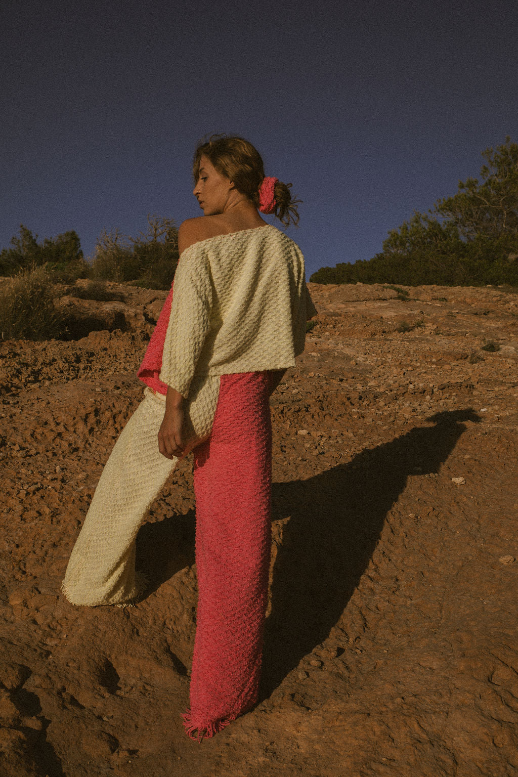 Handmade pastel patchwork towel set in pink and yellow, featuring long sleeve top and wide-leg trousers, upcycled in Ibiza.
