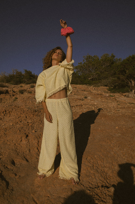 Upcycled bright yellow vintage cotton towel two-piece set with long sleeve top and wide-leg trousers.