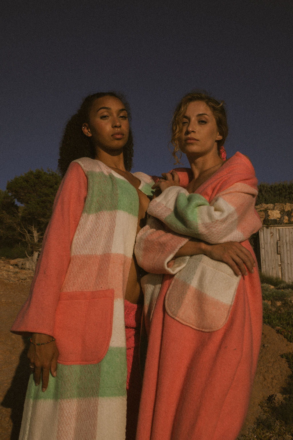 Recycled pastel patchwork jacket with checked sleeves and pink body, made from vintage blankets