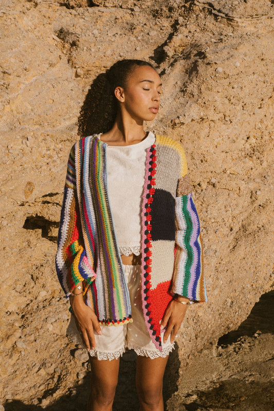 Rainbow striped patchwork upcycled crochet jacket made from vintage blankets, handmade in Ibiza.