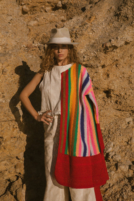 Rainbow patchwork crochet jacket with red panel hem, upcycled from vintage crochet blankets and handmade in Ibiza.