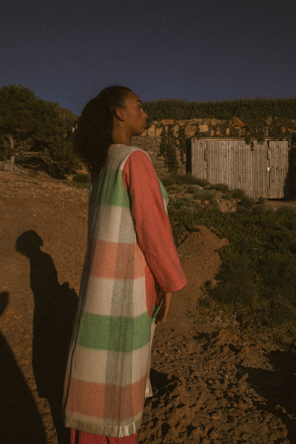 Recycled pastel patchwork jacket with checked sleeves and pink body, made from vintage blankets