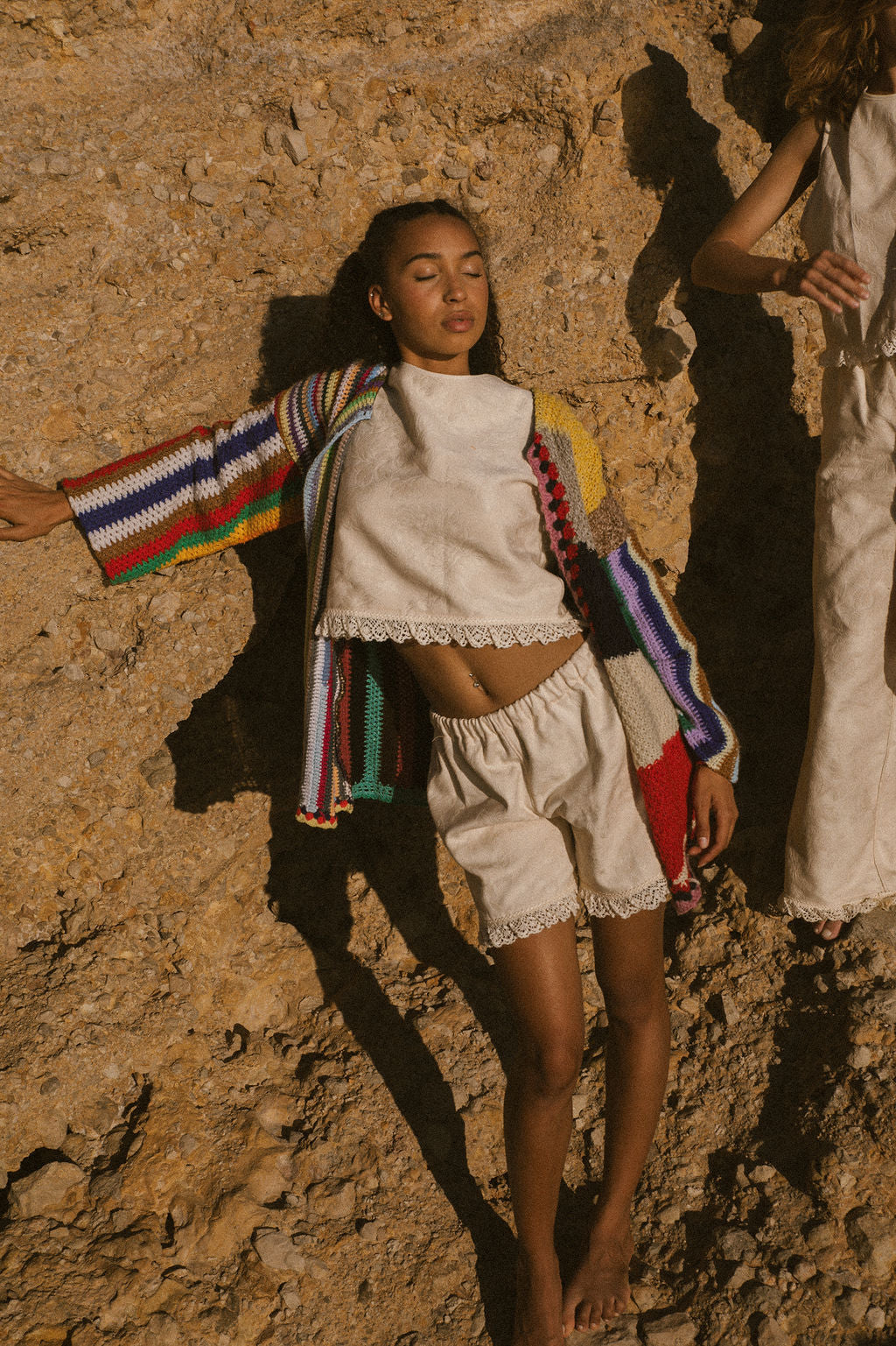 Rainbow striped patchwork upcycled crochet jacket made from vintage blankets, handmade in Ibiza.
