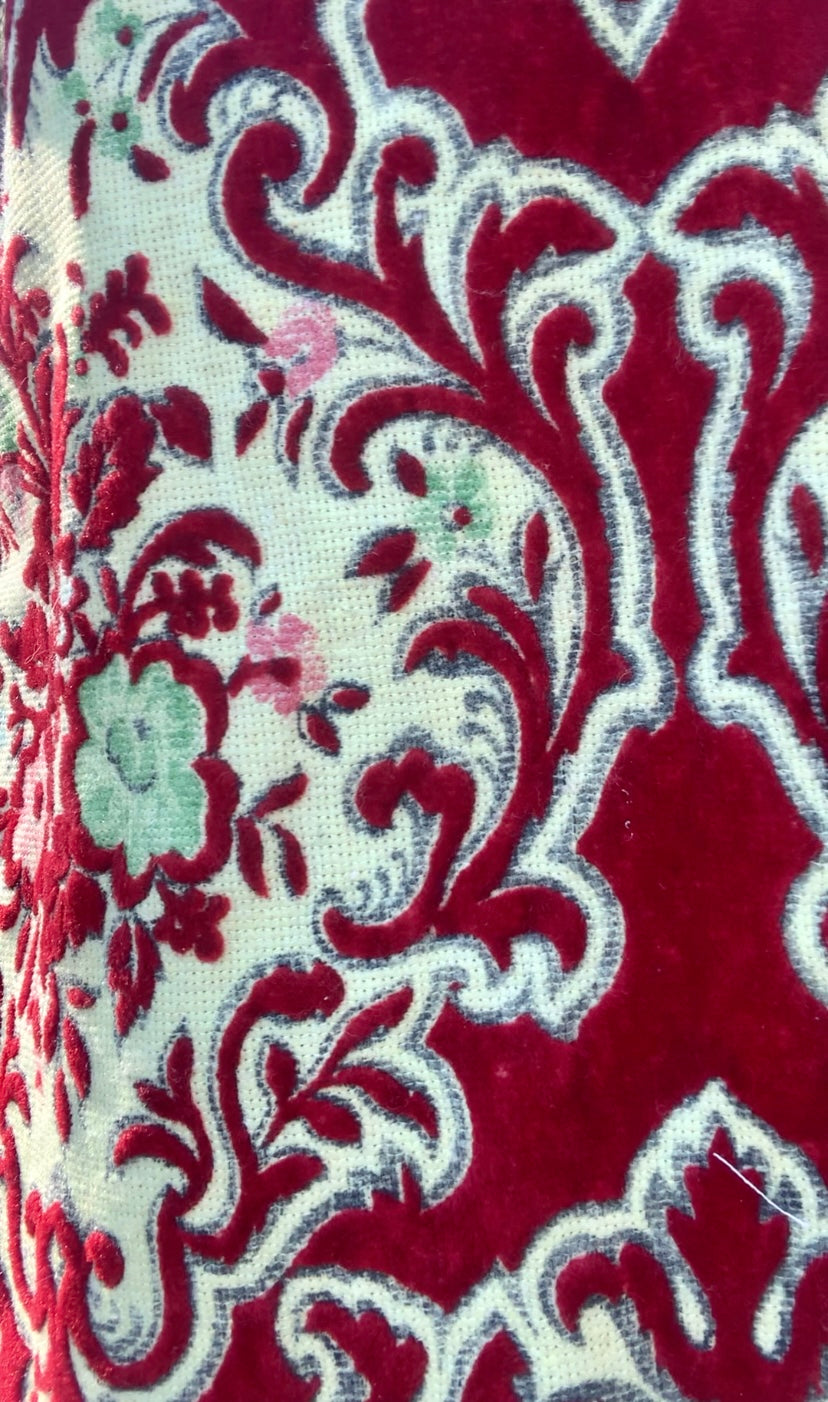 Vintage red and pastel yellow textiles with a burnet out devore Damascus pattern on the velvets pile very special textiles with tassel trim