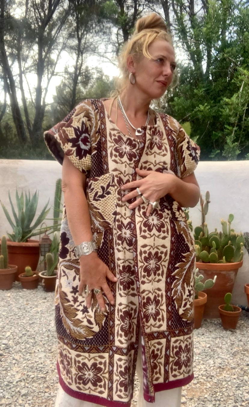 Up-cycled vintage blanket waistcoat jackets by Vagabond Ibiza with a brown and cream woven outside textiles lined with patterns fleece