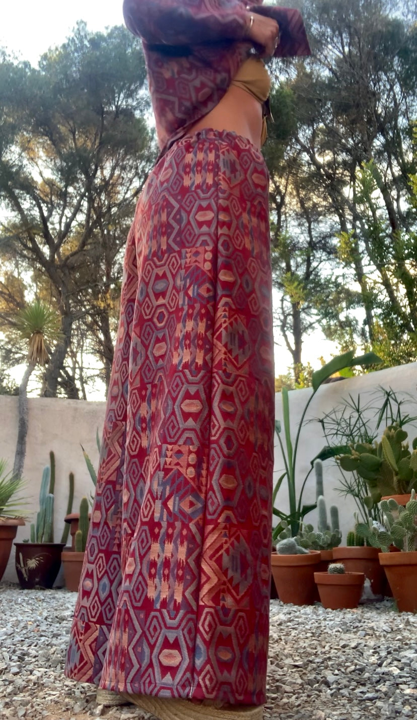 Very cool 2 piece sets made by Vagabond Ibiza from 1970’s upholstery fabrics in burgundy wide cropped long sleeve jackets and wide leg trousers with elastic waist