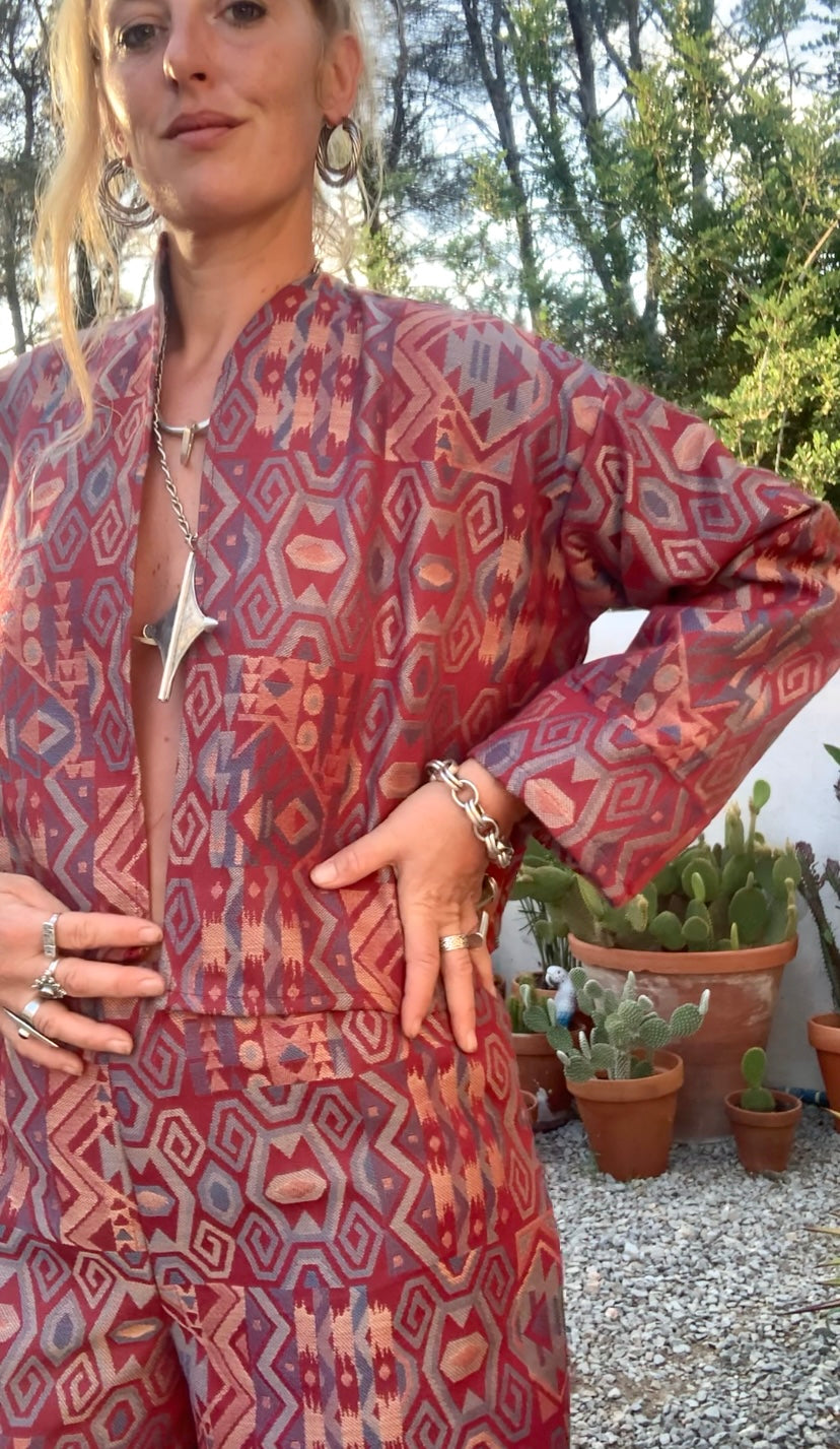 Very cool 2 piece sets made by Vagabond Ibiza from 1970’s upholstery fabrics in burgundy wide cropped long sleeve jackets and wide leg trousers with elastic waist
