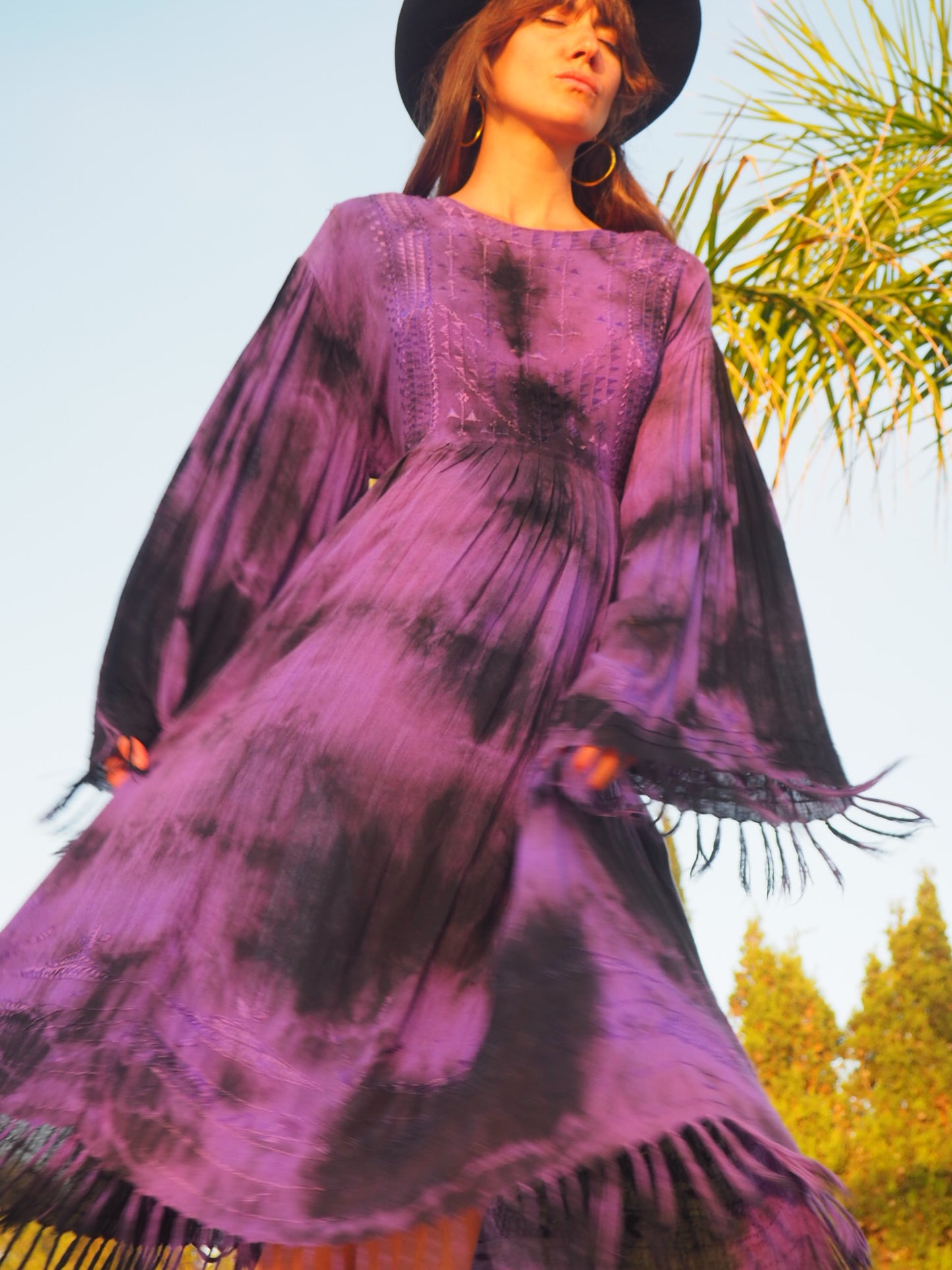 shop vintage online, affordable vintage clothing, vintage clothing store, vintage clothing brand, sustainable clothing brand, sustainable fashion, recycled fashion, slow fashion brand, recycled clothes, 70s vintage, bohemian vintage, affordable slow fashion, hippie boho, ethical fashion brand, hand stitched, festival fashion, Indian embroidery, vintage Indian , purple maxi dress, 70s dress, oversized sleeves, bell sleeves, tassel dress, boho dress, bohemian vintage, purple hippie dress, 1970s fashion