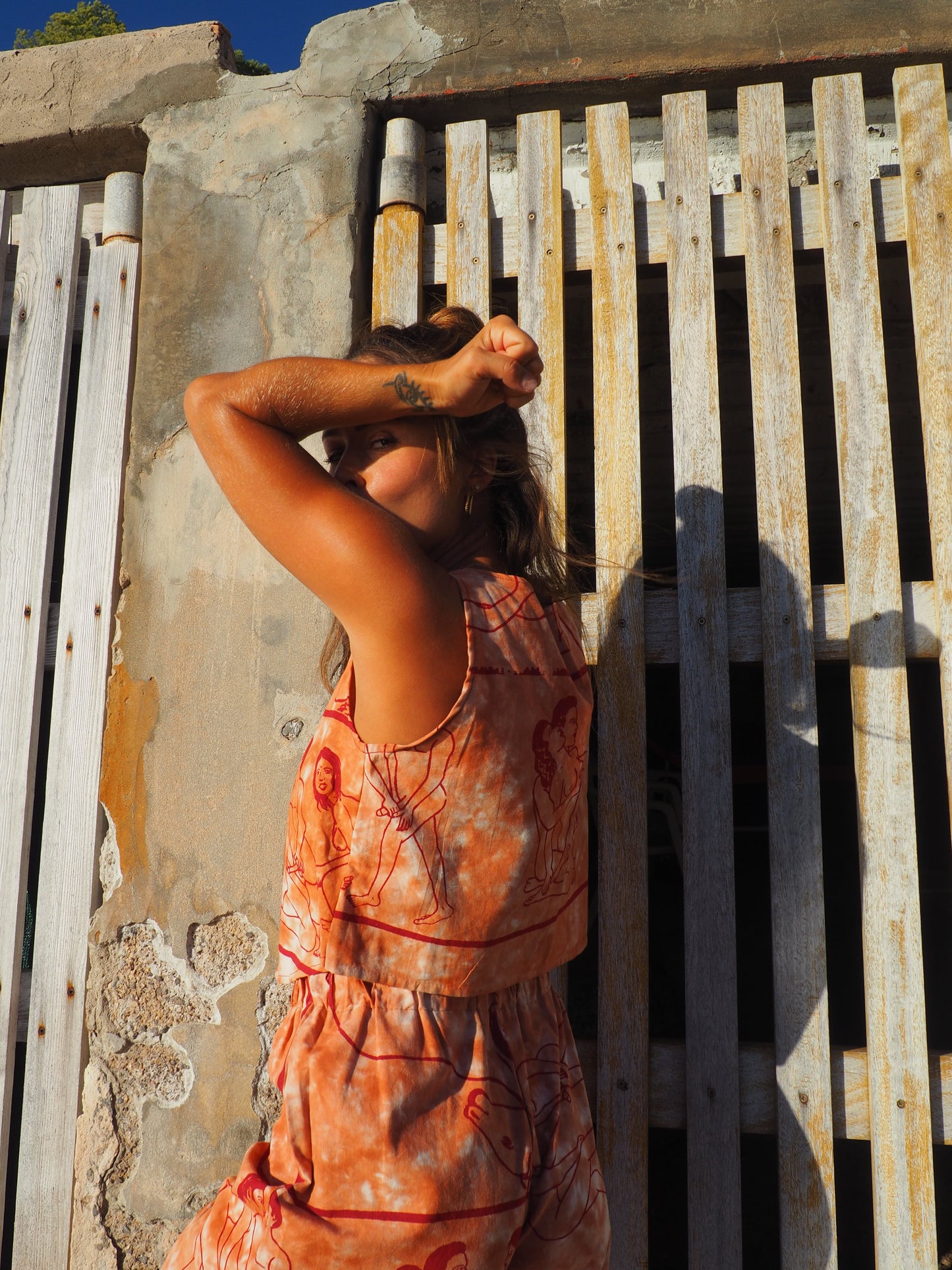 Up-cycled vintage cotton reversible crop top with printed karma sutra design in burnt orange.