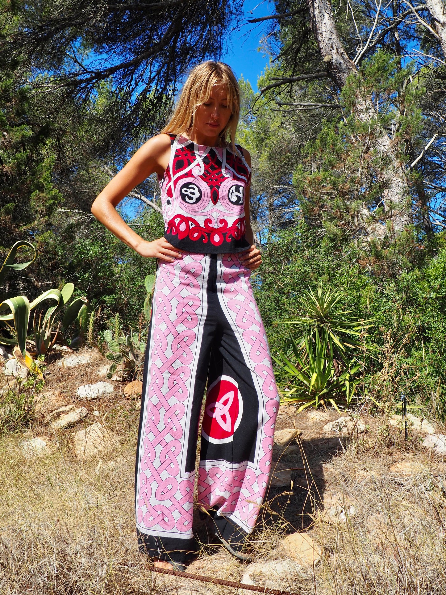 Up-cycled cotton wide leg pants pink and black with vibrant print design and circular motifs by Vagabond Ibiza
