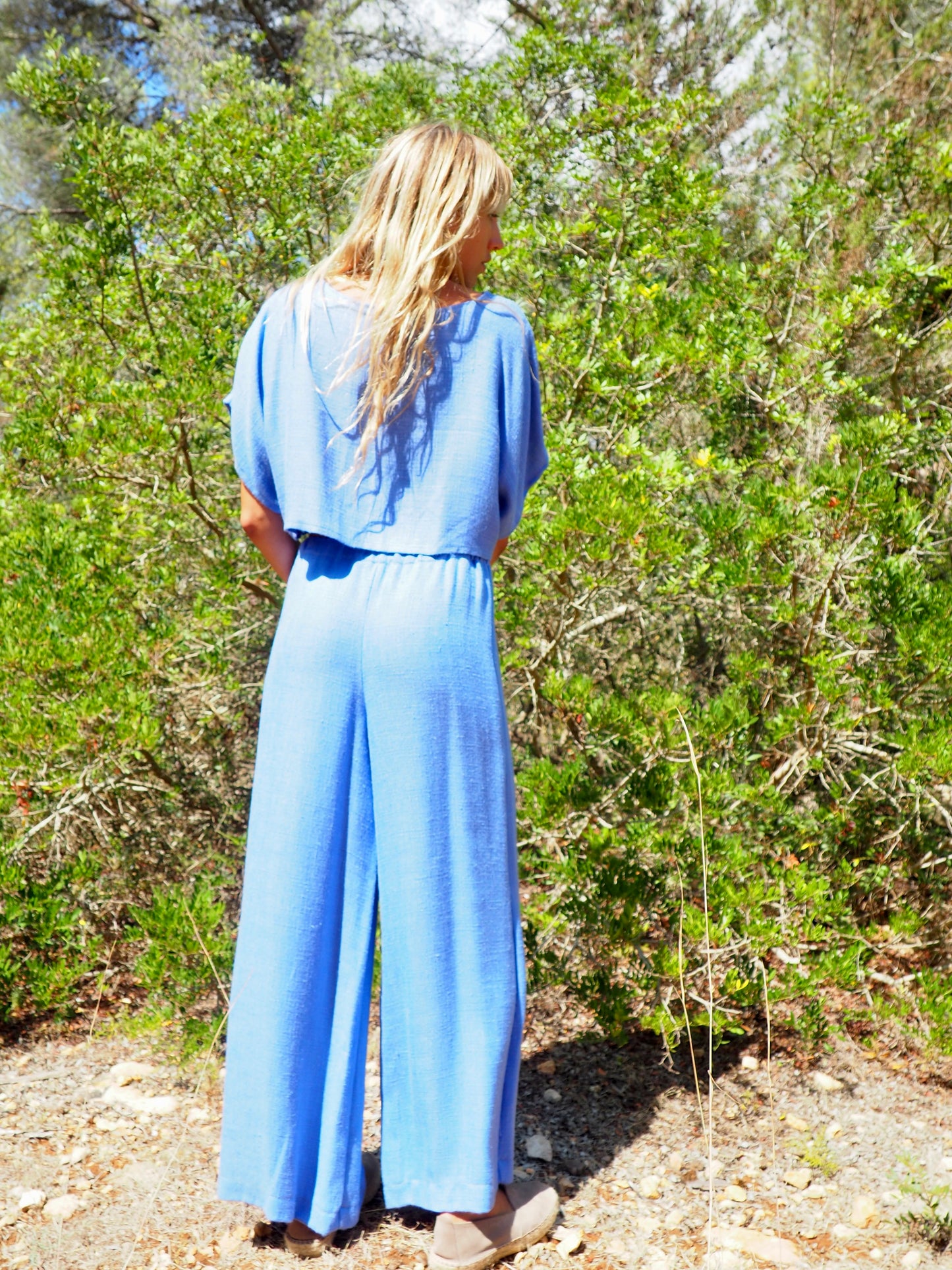 Up-cycled beautiful blue wide leg pants with elastic waist nice quality a high end woven textile possibly a silk and cotton blend super soft with nice movement made by Vagabond Ibiza