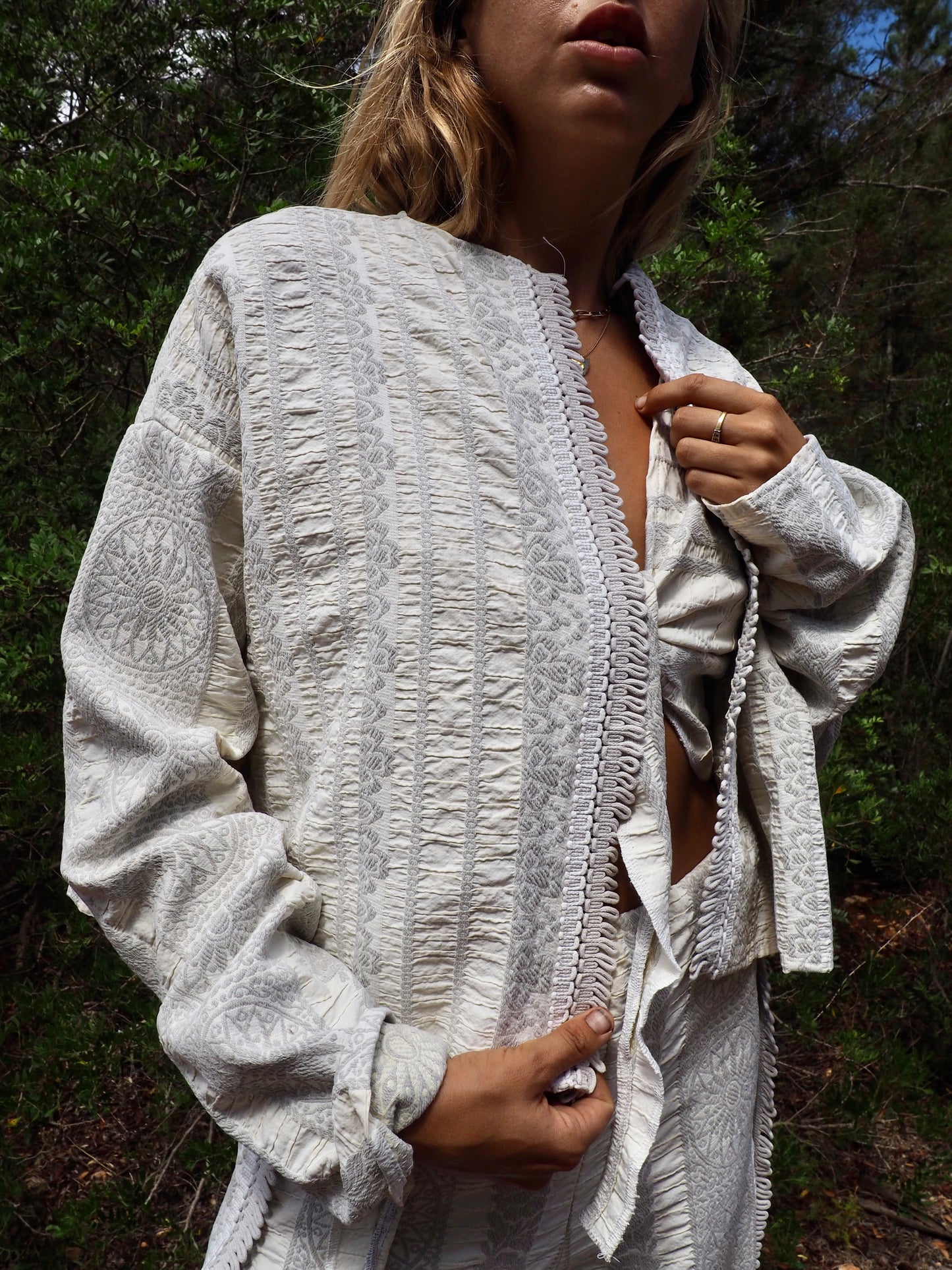 Up-cycled heavy cotton woven textile cropped jacket with super cool oversize long sleeves can be worn long as a statement made by Vagabond Ibiza