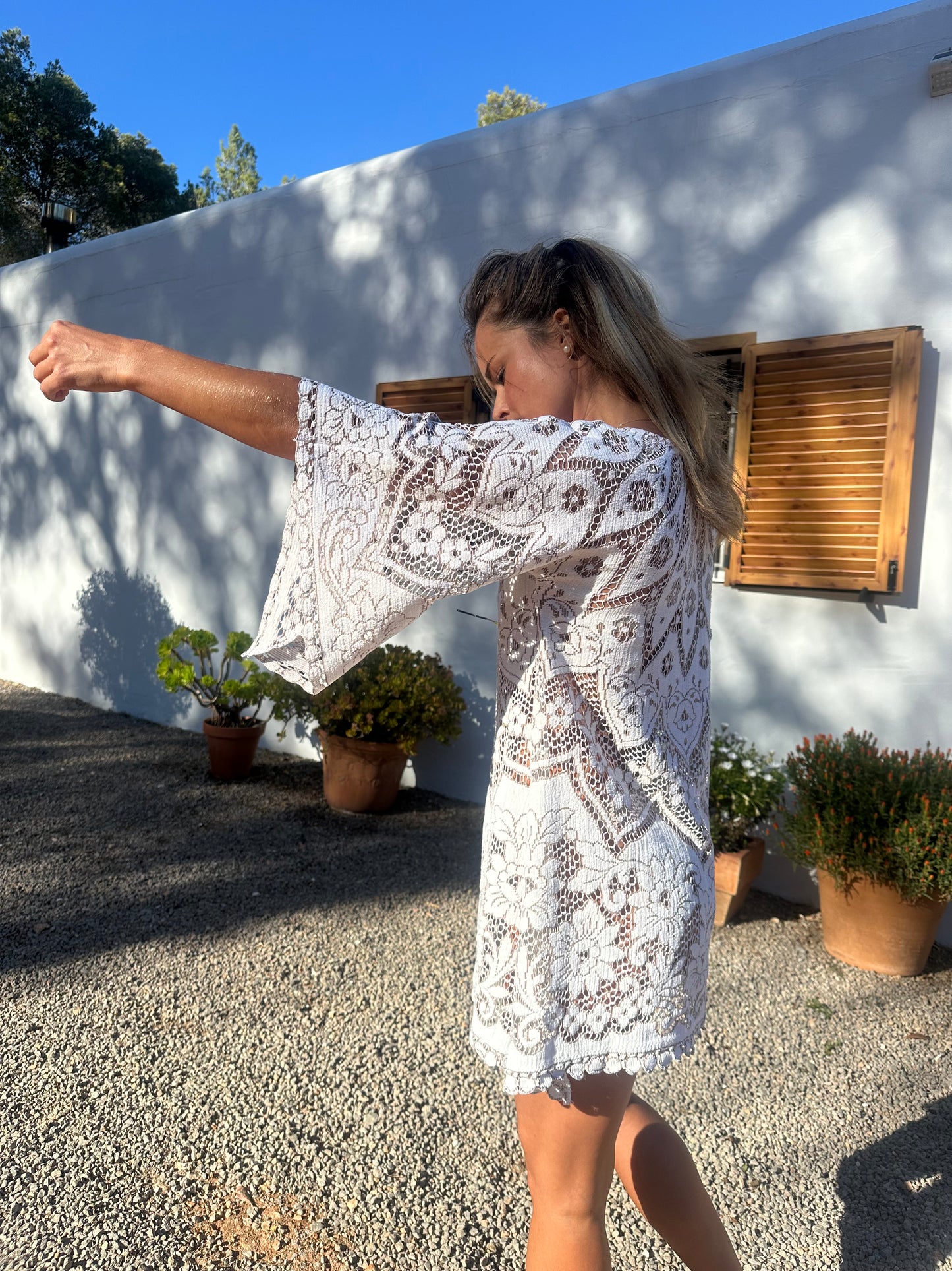 White vintage lace upcycled bell sleeve dress made by Vagabond Ibiza