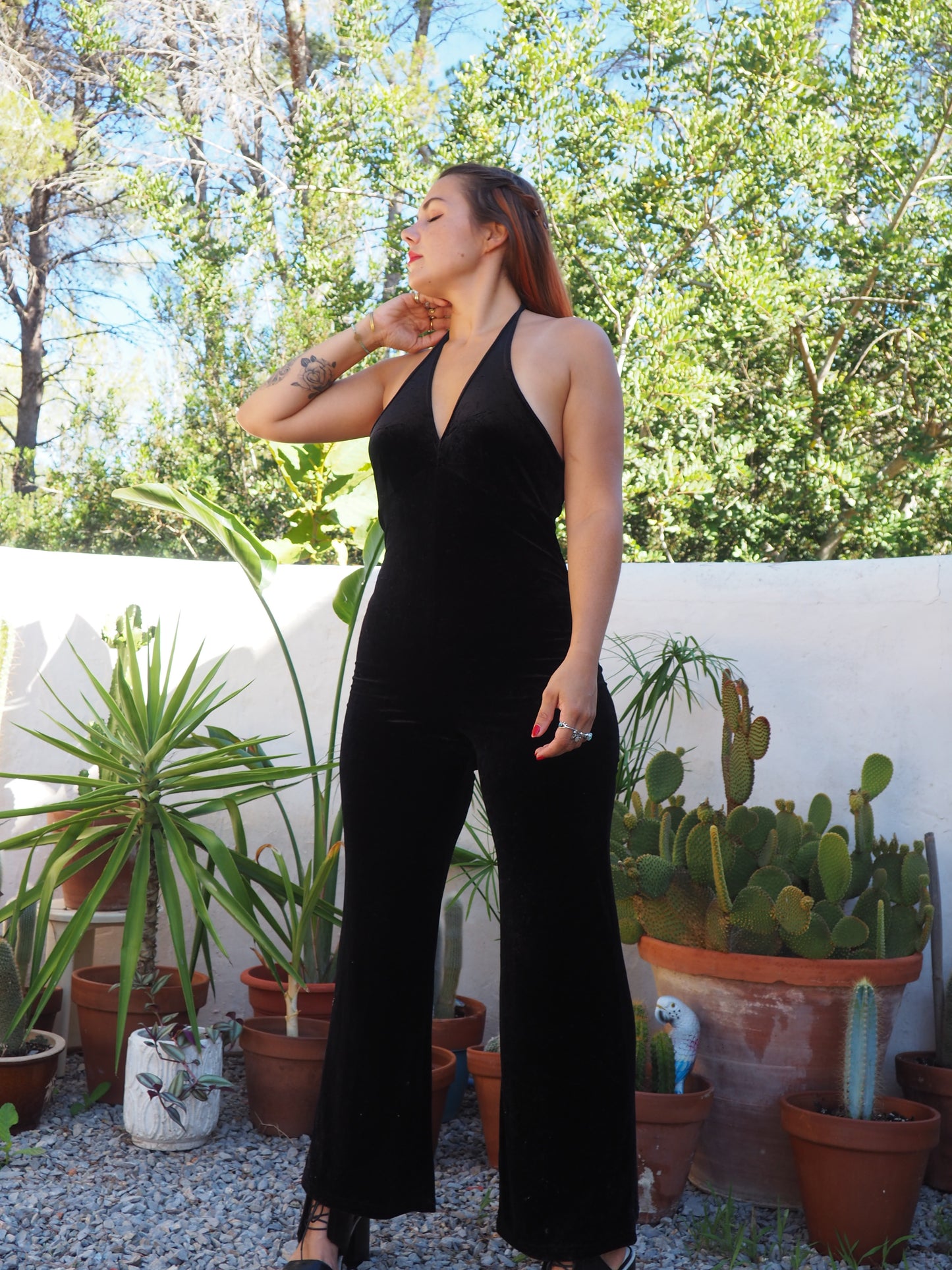 Vintage black thin velvet halter neck jumpsuit with bell bottom flare with stretch