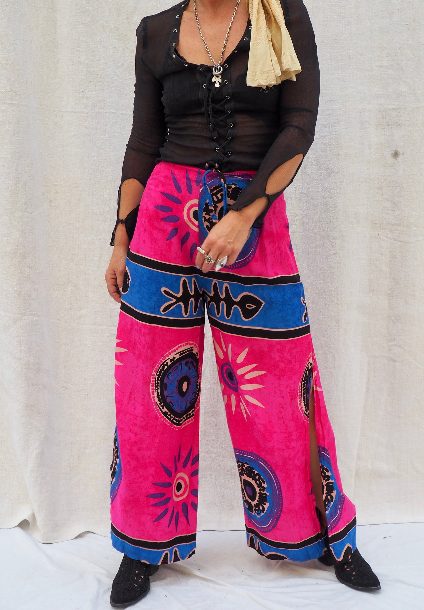 Wrap pants with side splits in pink and blue patterned design