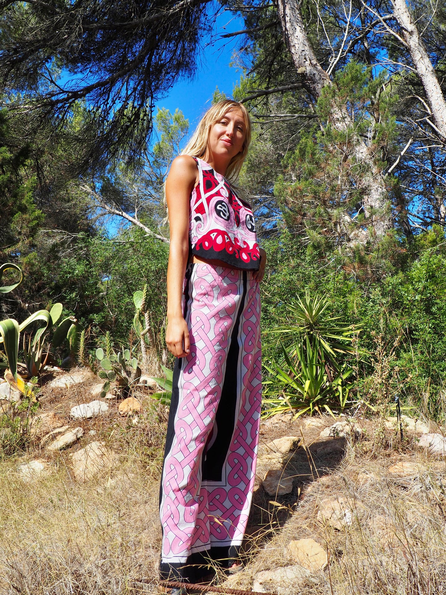 Up-cycled cotton wide leg pants pink and black with vibrant print design and circular motifs by Vagabond Ibiza