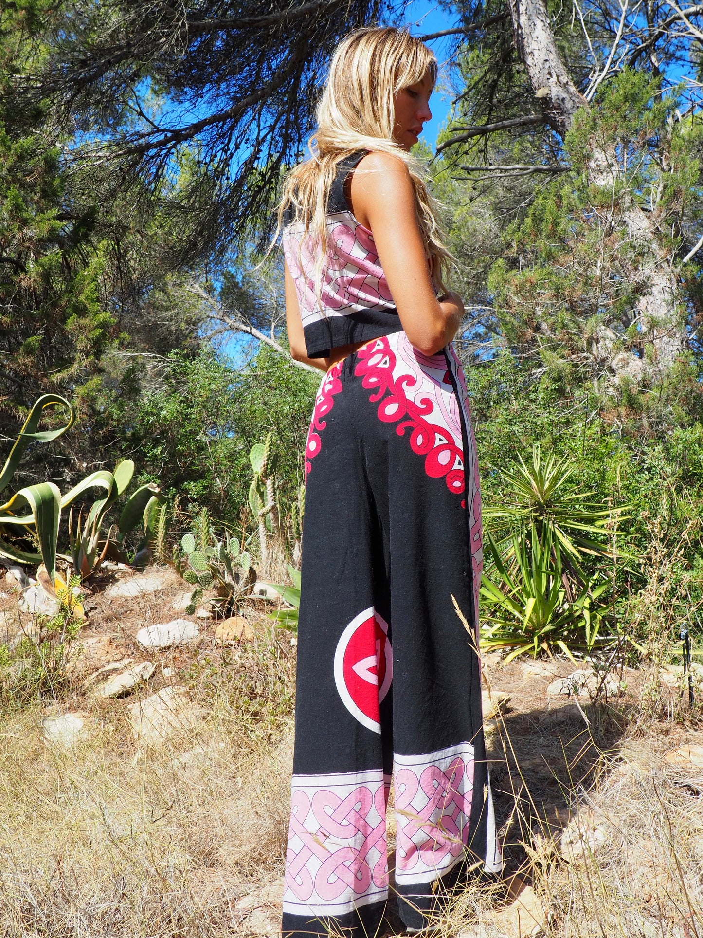 Up-cycled cotton wide leg pants pink and black with vibrant print design and circular motifs by Vagabond Ibiza