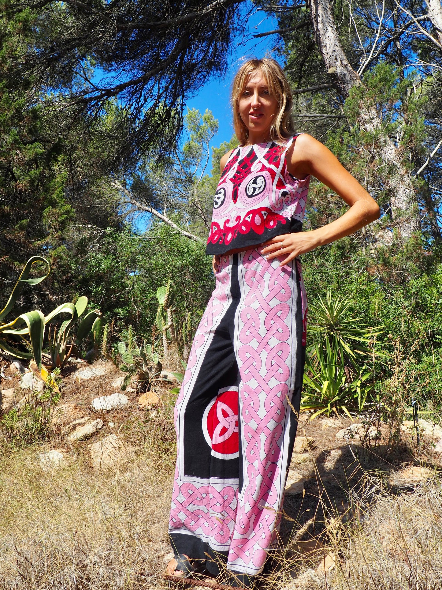 Up-cycled cotton wide leg pants pink and black with vibrant print design and circular motifs by Vagabond Ibiza