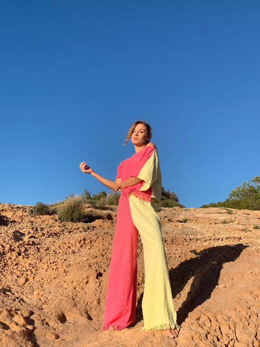 Handmade pastel patchwork towel set in pink and yellow, featuring long sleeve top and wide-leg trousers, upcycled in Ibiza.
