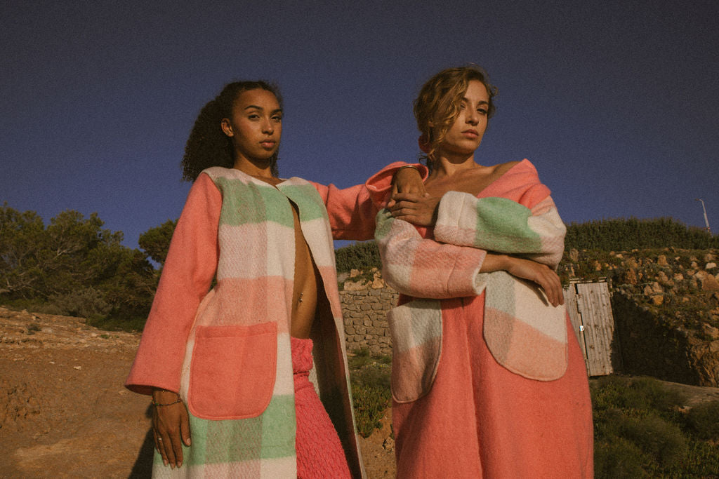 Recycled pastel patchwork jacket with checked sleeves and pink body, made from vintage blankets
