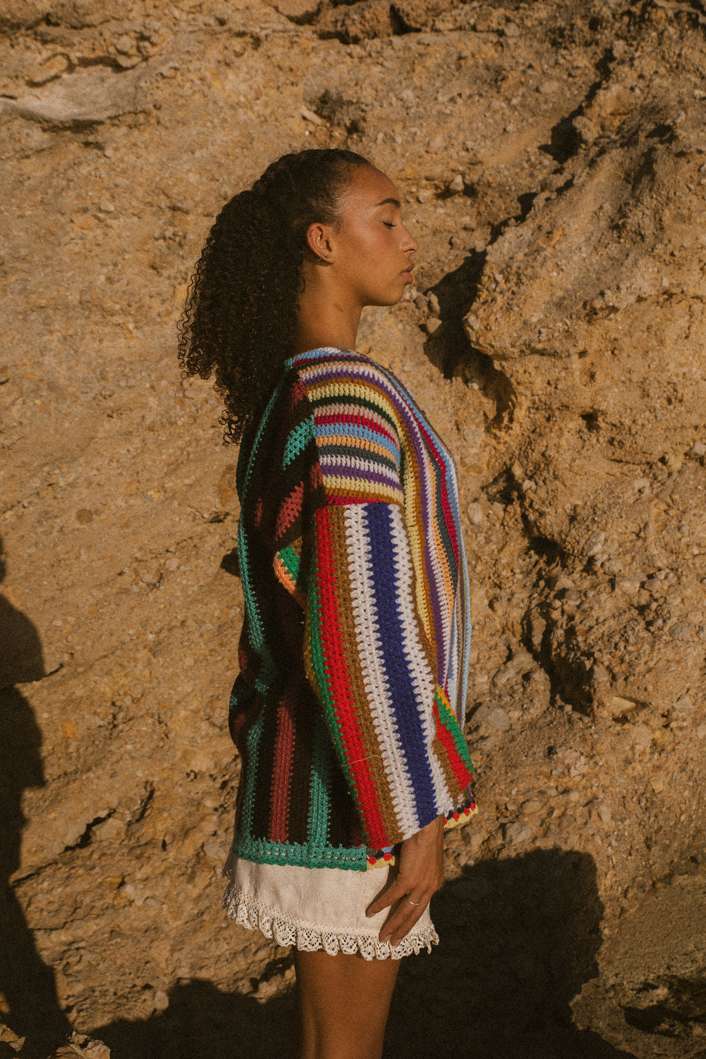 Rainbow striped patchwork upcycled crochet jacket made from vintage blankets, handmade in Ibiza.