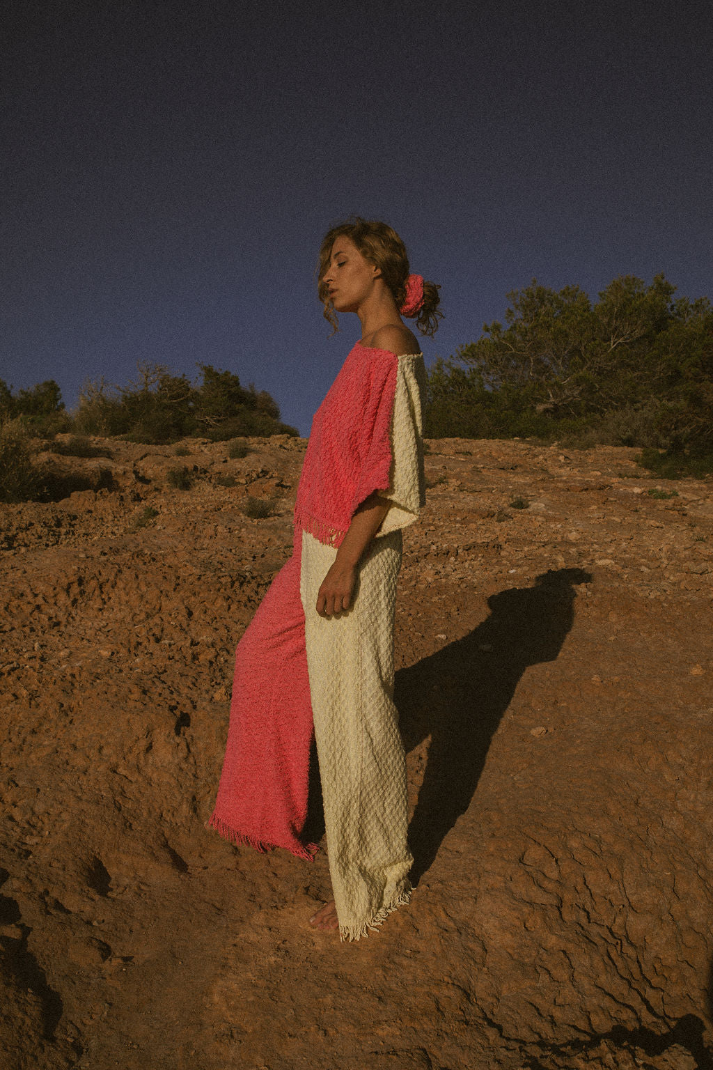 Handmade pastel patchwork towel set in pink and yellow, featuring long sleeve top and wide-leg trousers, upcycled in Ibiza.
