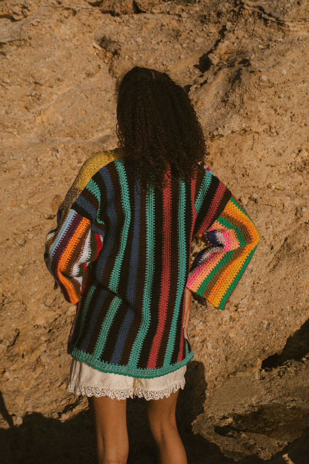 Rainbow striped patchwork upcycled crochet jacket made from vintage blankets, handmade in Ibiza.