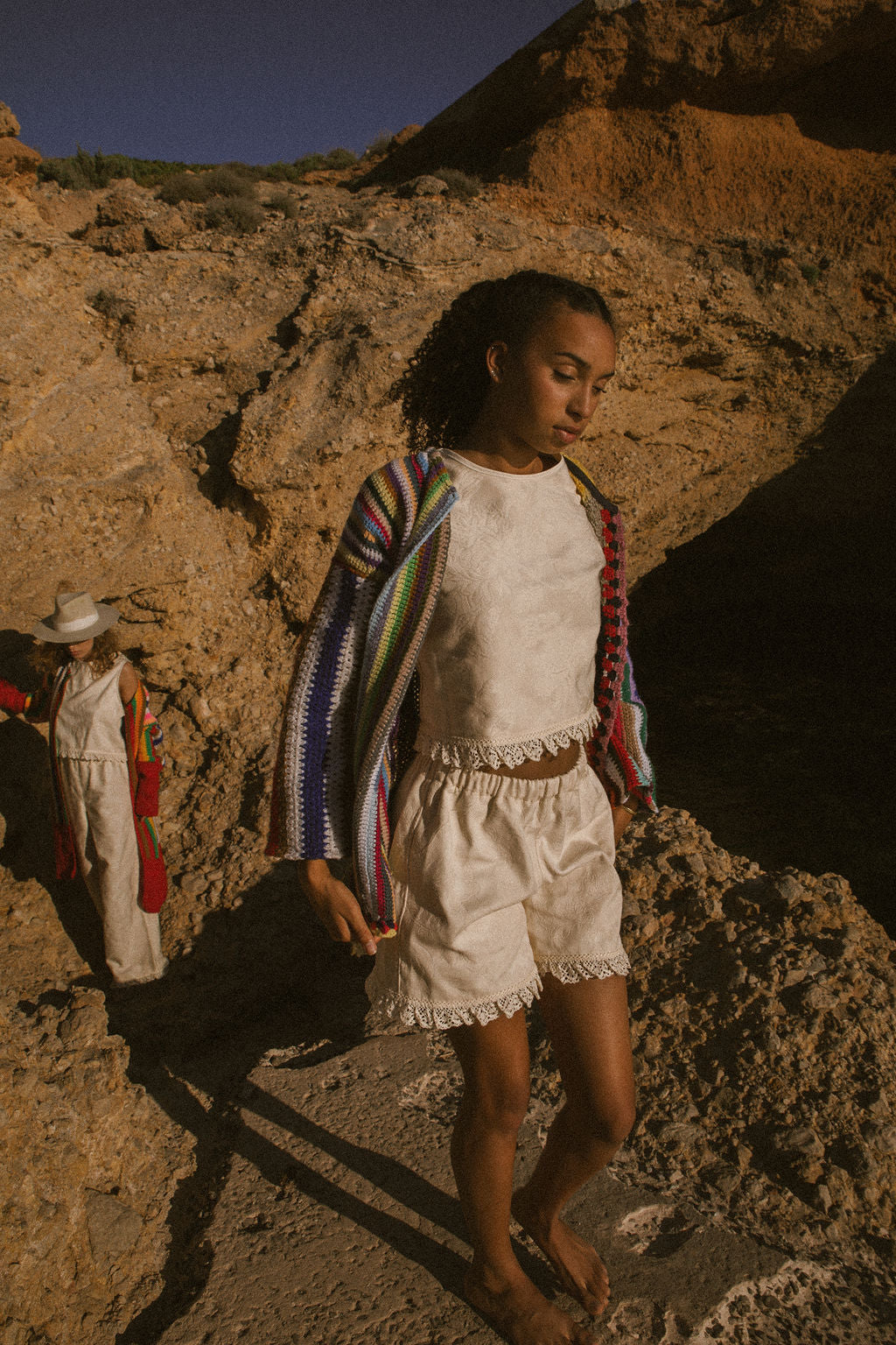 Rainbow striped patchwork upcycled crochet jacket made from vintage blankets, handmade in Ibiza.
