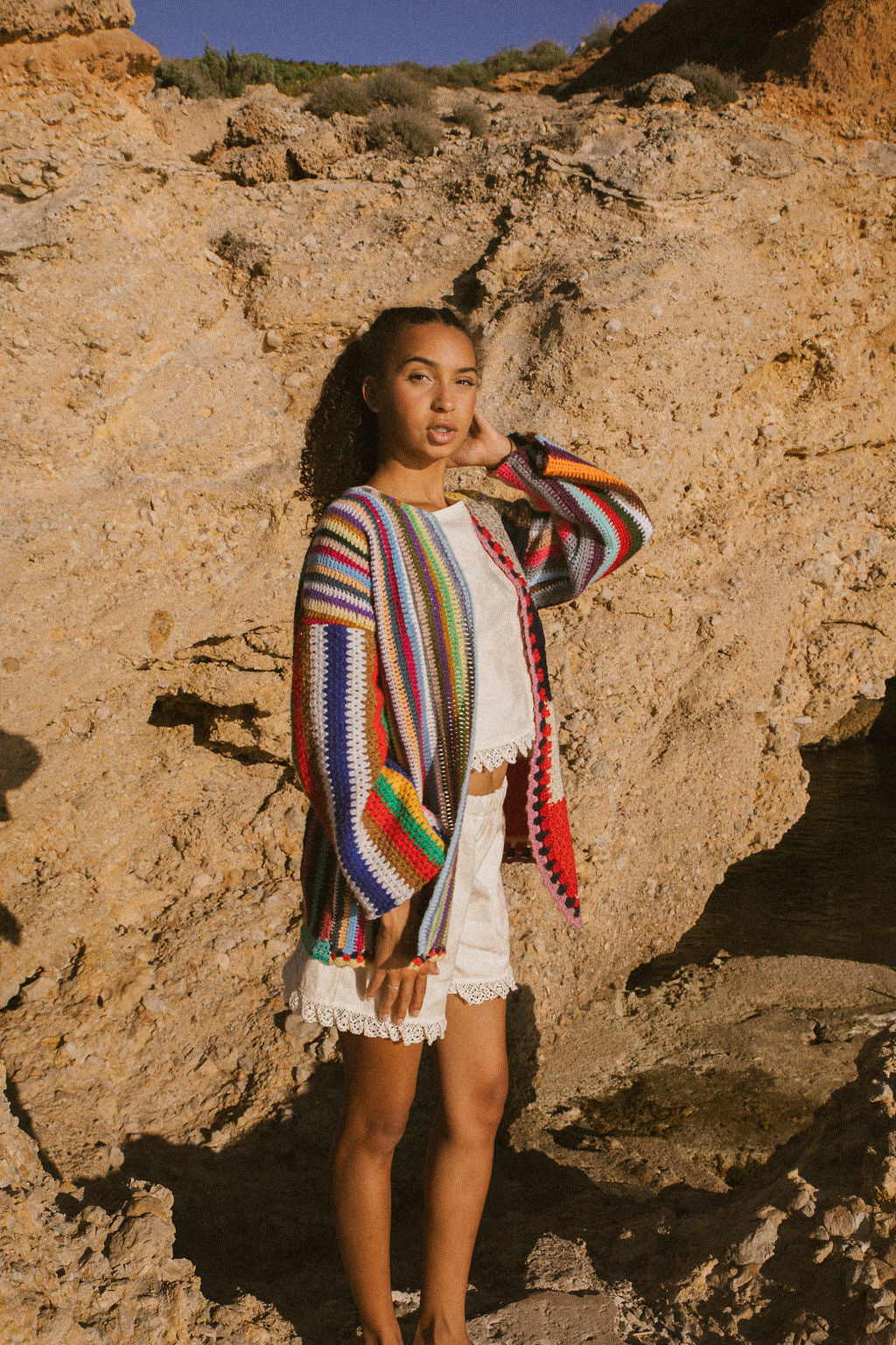 Rainbow striped patchwork upcycled crochet jacket made from vintage blankets, handmade in Ibiza.