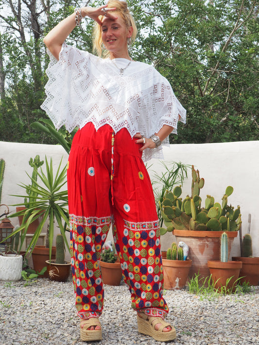 Original vintage 1970’s Indian hand embroidered pants on bright red cotton textiles and a draw string waist very cool