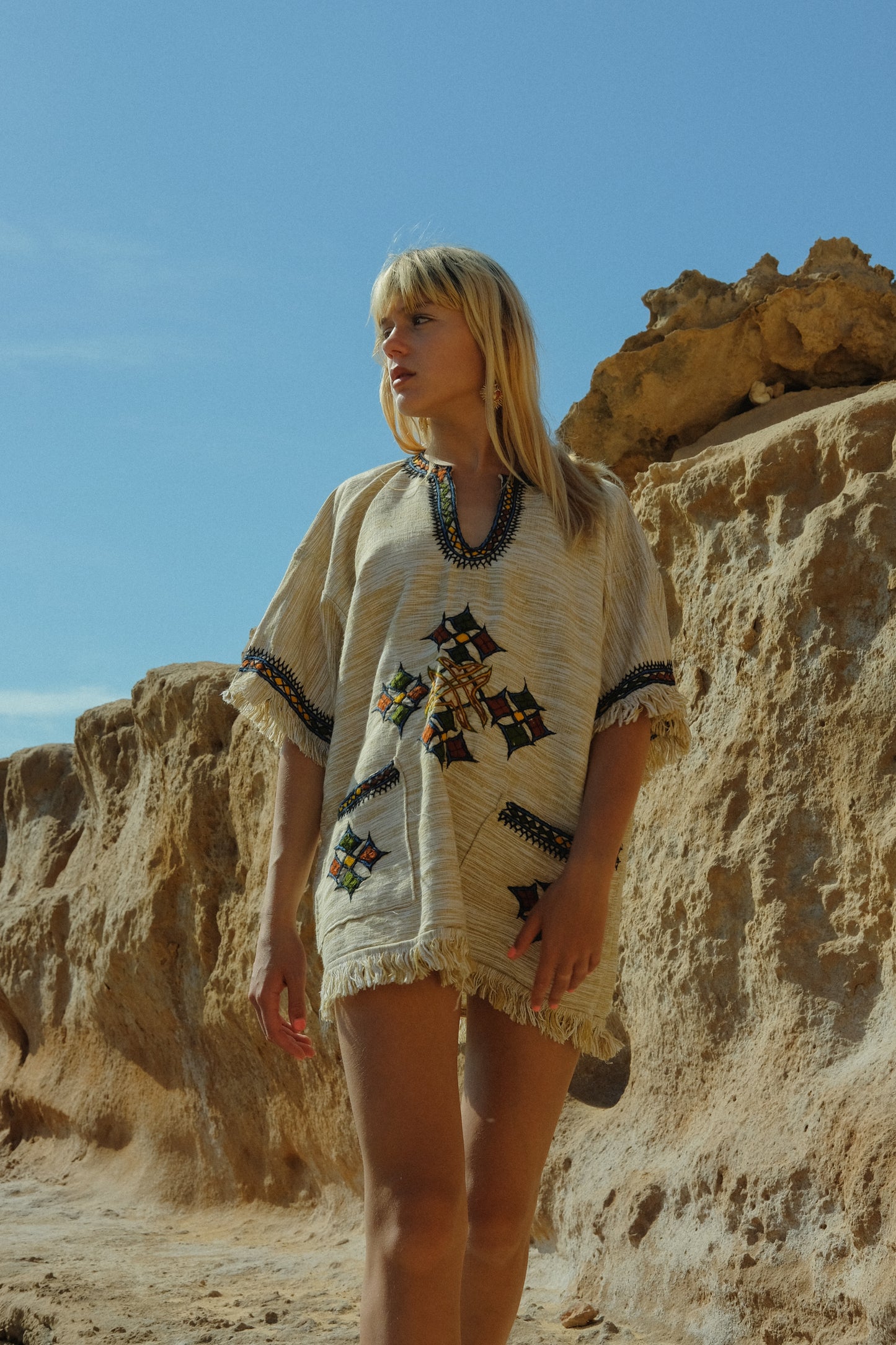 Vintage cream cotton shirt from Ethiopia with cute fringe details and embroidered motifs