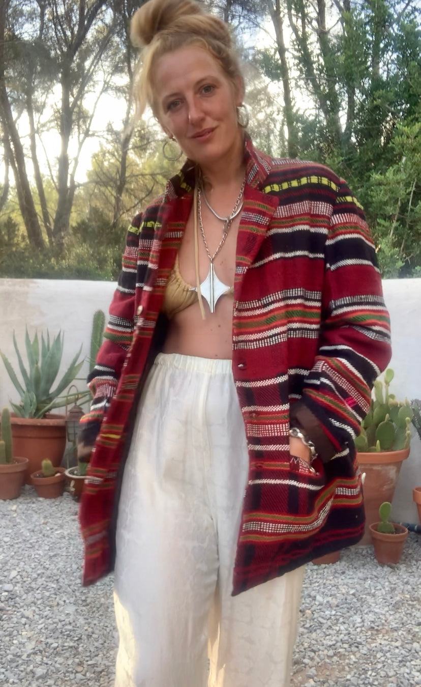 Original vintage woven Moroccan blanket jacket with red and black stripped design pockets and buttons up the front lined with black cotton